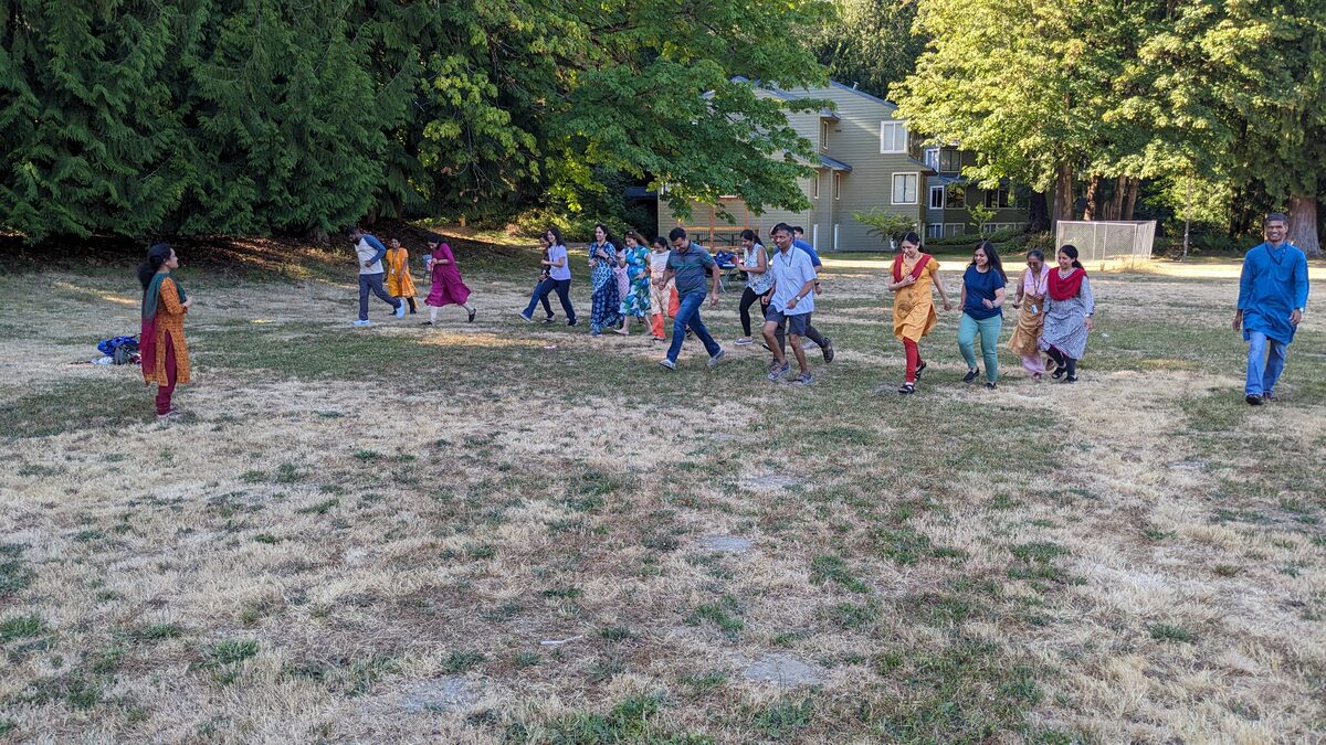 Adults playing outdoor games at Vitastaa camp